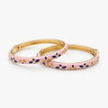 Pink floral enamel bangle bracelet set with crystal accents, angled view