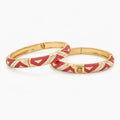 Red chevron bangle set with silver-tone accent stripe, angled view