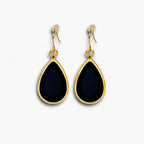 Black teardrop hook earrings with gold-tone border – front view