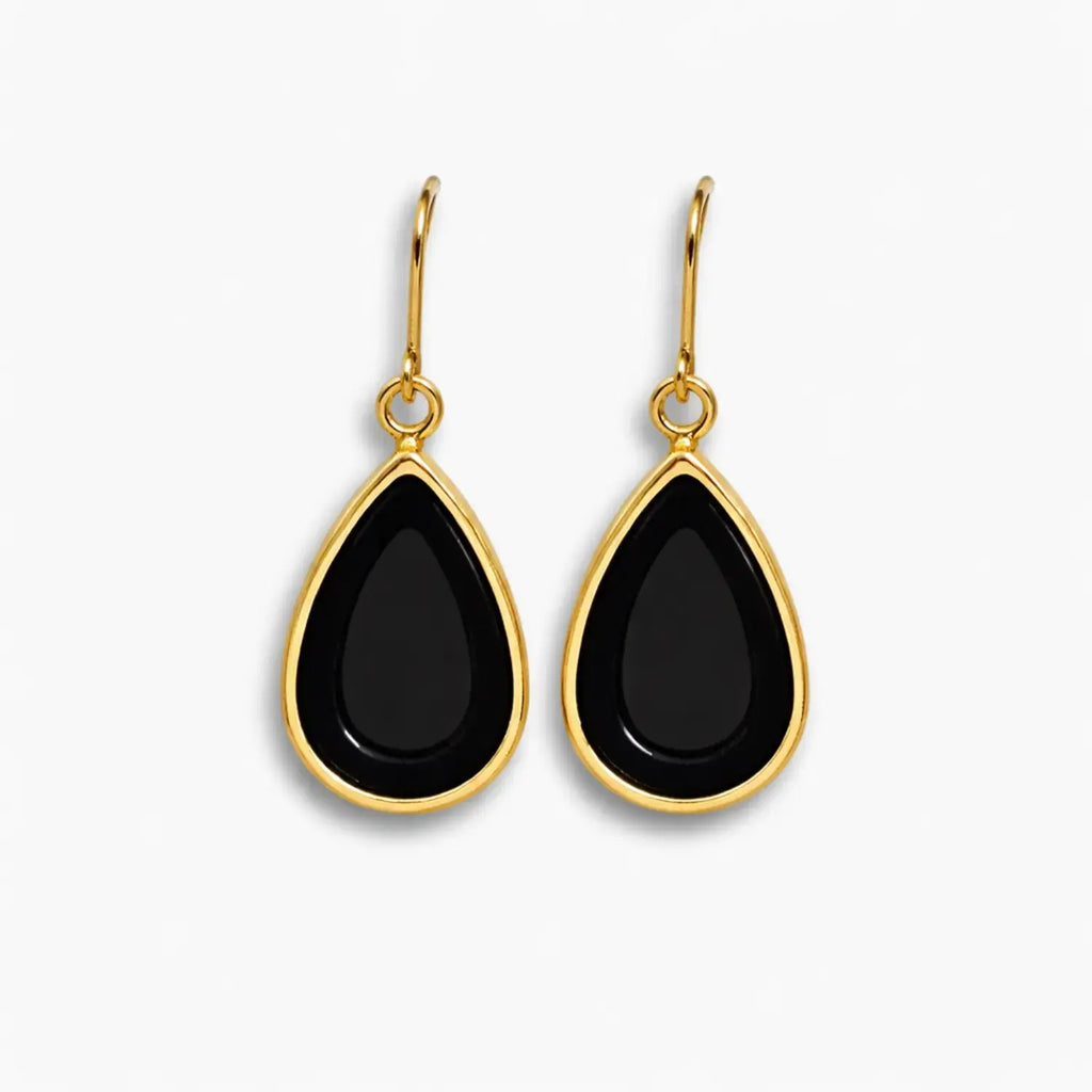Black teardrop earrings with gold hooks on a white background