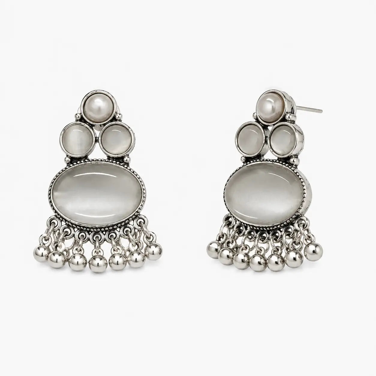 Artificial silver earrings with grey oval stone-look centres, pearl-look tops and dangling bead fringe, angled view