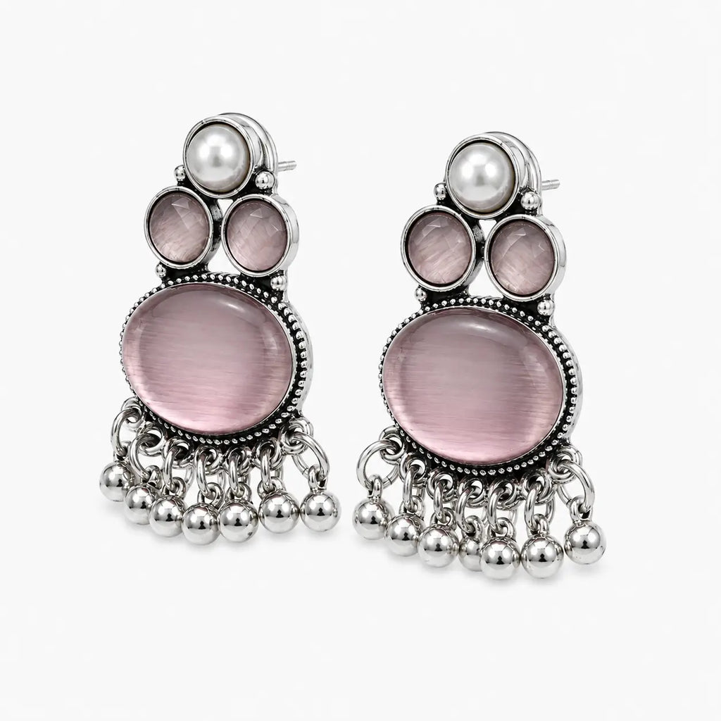 Artificial silver earrings with pale pink stone-look centres, pearl-look tops and dangling bead fringe, angled view