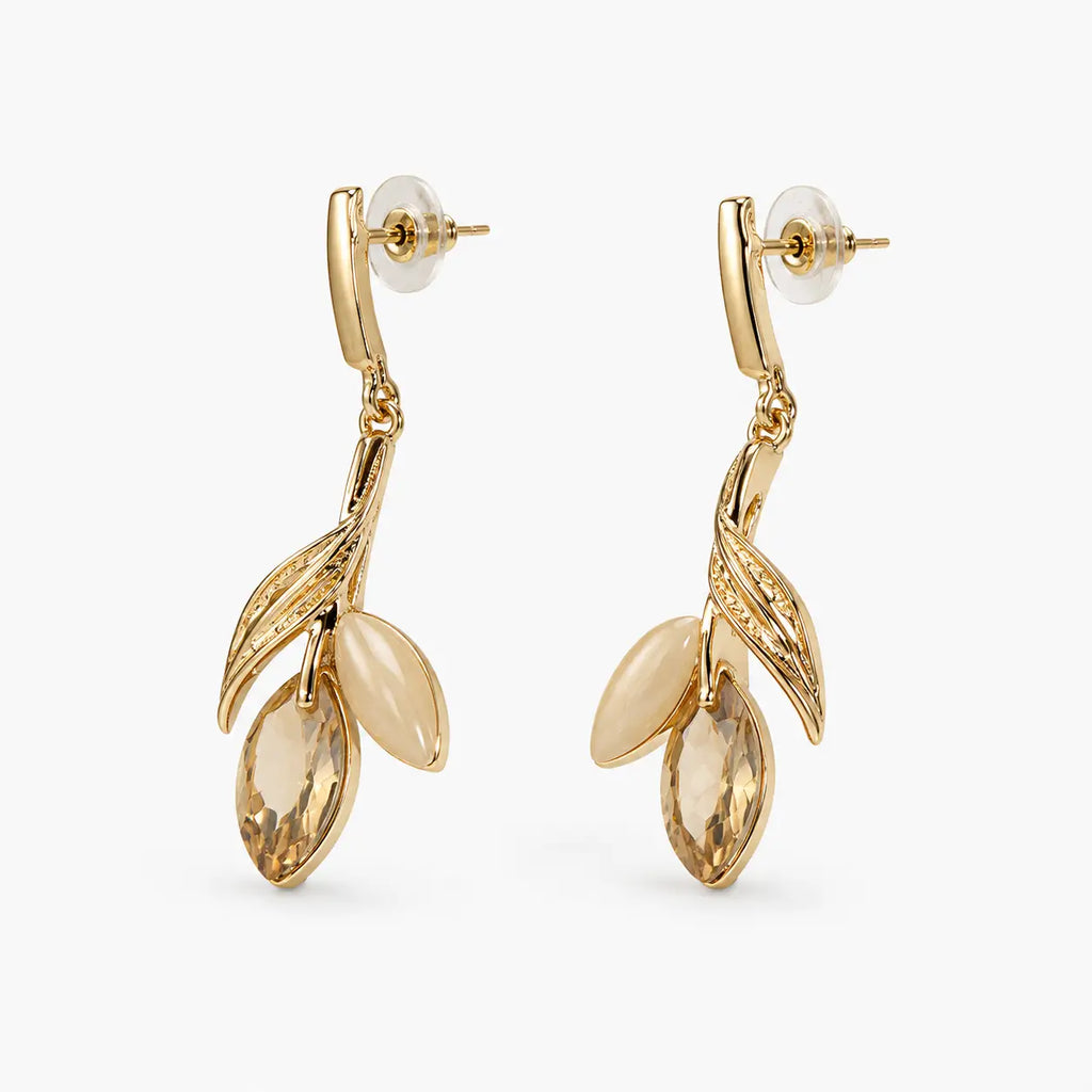 Side angle of leaf charm drop earrings with marquise crystal and bead detail