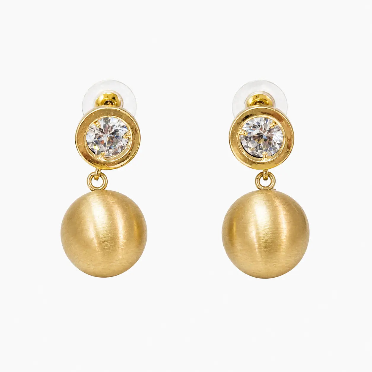 Crystal stud and brushed gold ball drop earrings on white background, front view