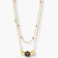 Black floral layered necklace with gold-colour bead accents
