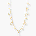 hand and disc charm station necklace on long gold-colour chain