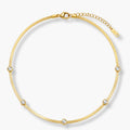 Complete view of clear-accent gold-color collar necklace with round stations