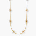 white floral station necklace with gold-color flower centres

