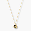 black-centre rounded pendant necklace on fine gold-color chain
