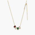 gold-color oval cluster necklace with deep red clear green and light pink accents
