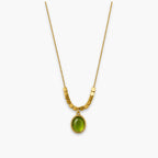 Green oval pendant necklace with bead-and-bar chain accents