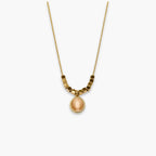 Peach oval pendant necklace with bead-and-bar chain accents