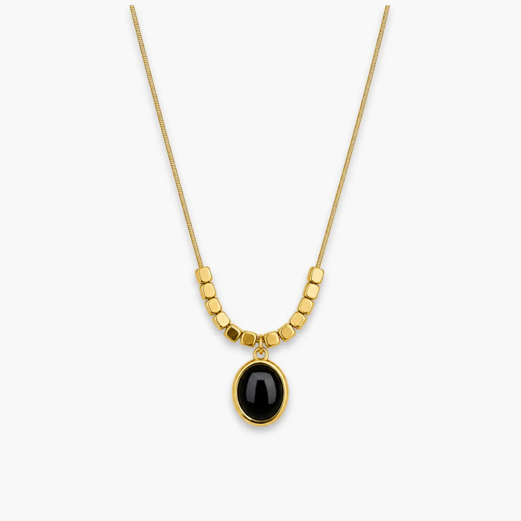 Black oval pendant necklace with bead-and-bar chain accents