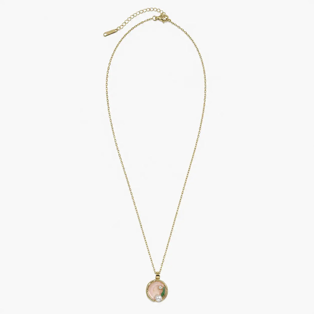 Full view of the gold-tone necklace for women with round pink pearl pendant, fine chain, clasp and extender.