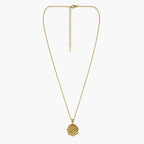 Full view of the gold-tone pendant necklace with floral coin charm, fine chain, clasp and long extender.