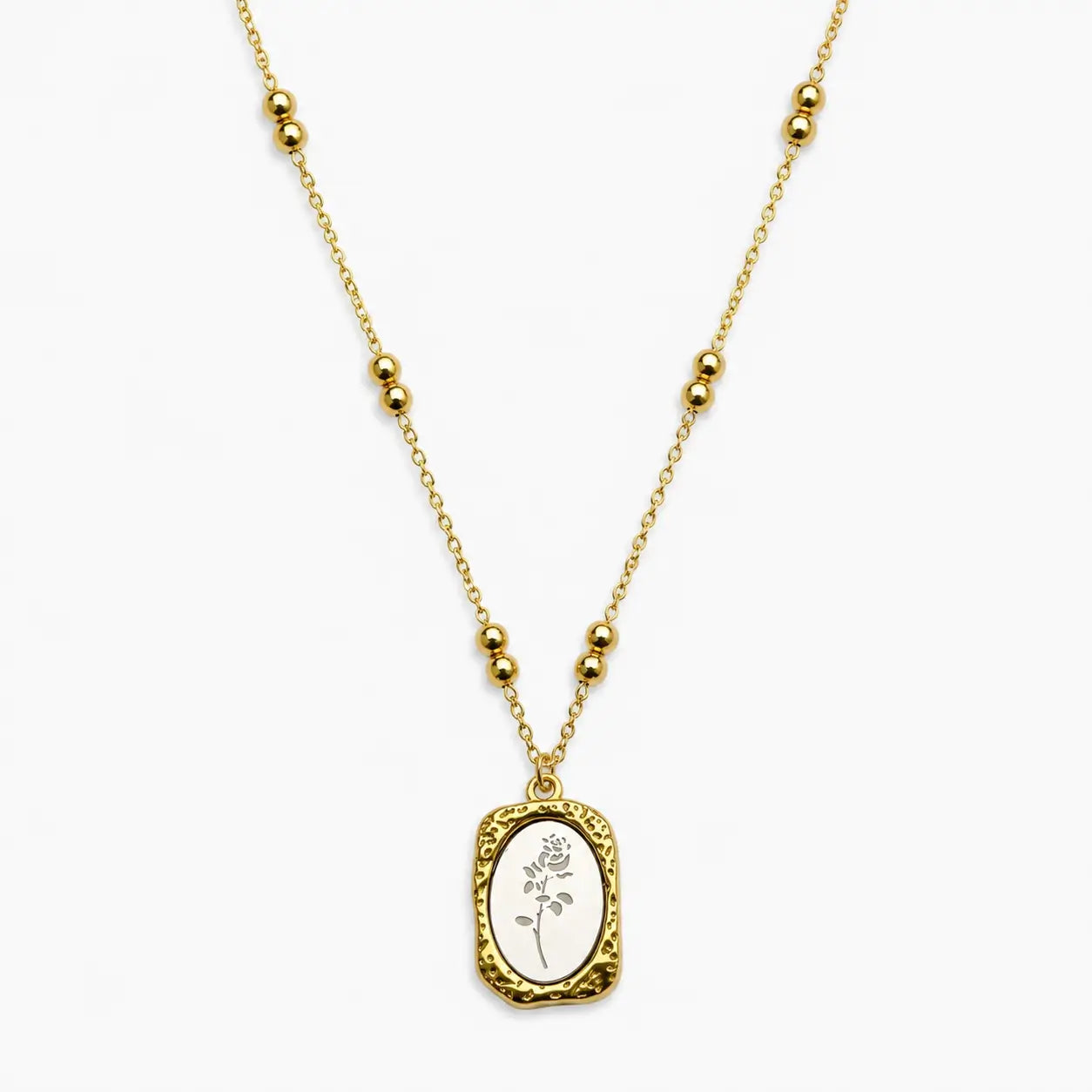 Close-up of a Two-tone chain necklace with paired beads and a textured rectangular rose pendant.