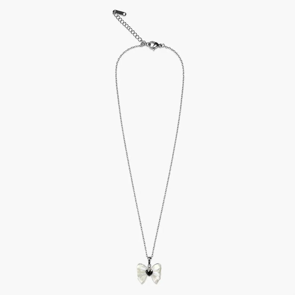 Full view of the silver-tone necklace for girls with bow pendant, fine chain, lobster clasp and extender.