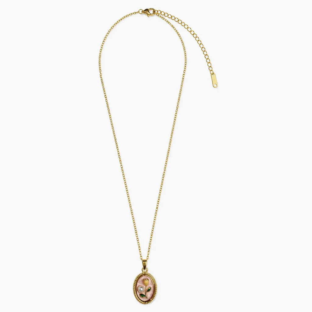 Full view of the gold-tone necklace for women with a pink floral pendant, fine chain, clasp and extender.