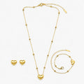 Gold-tone artificial necklace set with heart pendant, beaded bracelet and matching heart stud earrings.