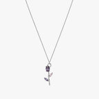 Close-up of purple and pink crystal tulip pendant on fine silver-tone chain