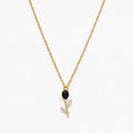 Close-up of black crystal tulip pendant with marquise leaf details on gold-tone chain