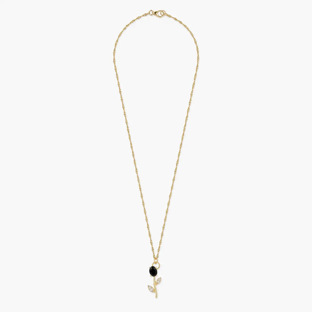 Gold-tone black crystal tulip pendant necklace on white background, full chain view