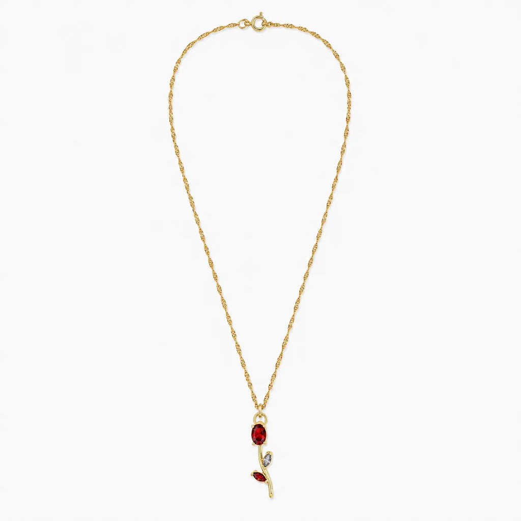 Close-up of red crystal tulip pendant with marquise leaf details on gold-tone chain