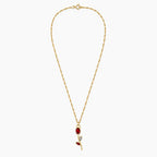 Close-up of red crystal tulip pendant with marquise leaf details on gold-tone chain