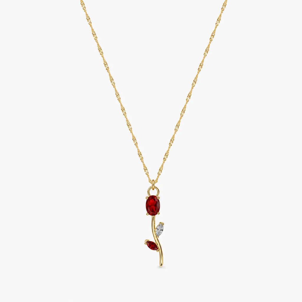 Close-up of red crystal tulip pendant with marquise leaf details on gold-tone chain