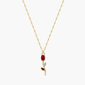 Close-up of red crystal tulip pendant with marquise leaf details on gold-tone chain