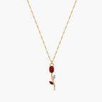 Close-up of red crystal tulip pendant with marquise leaf details on gold-tone chain