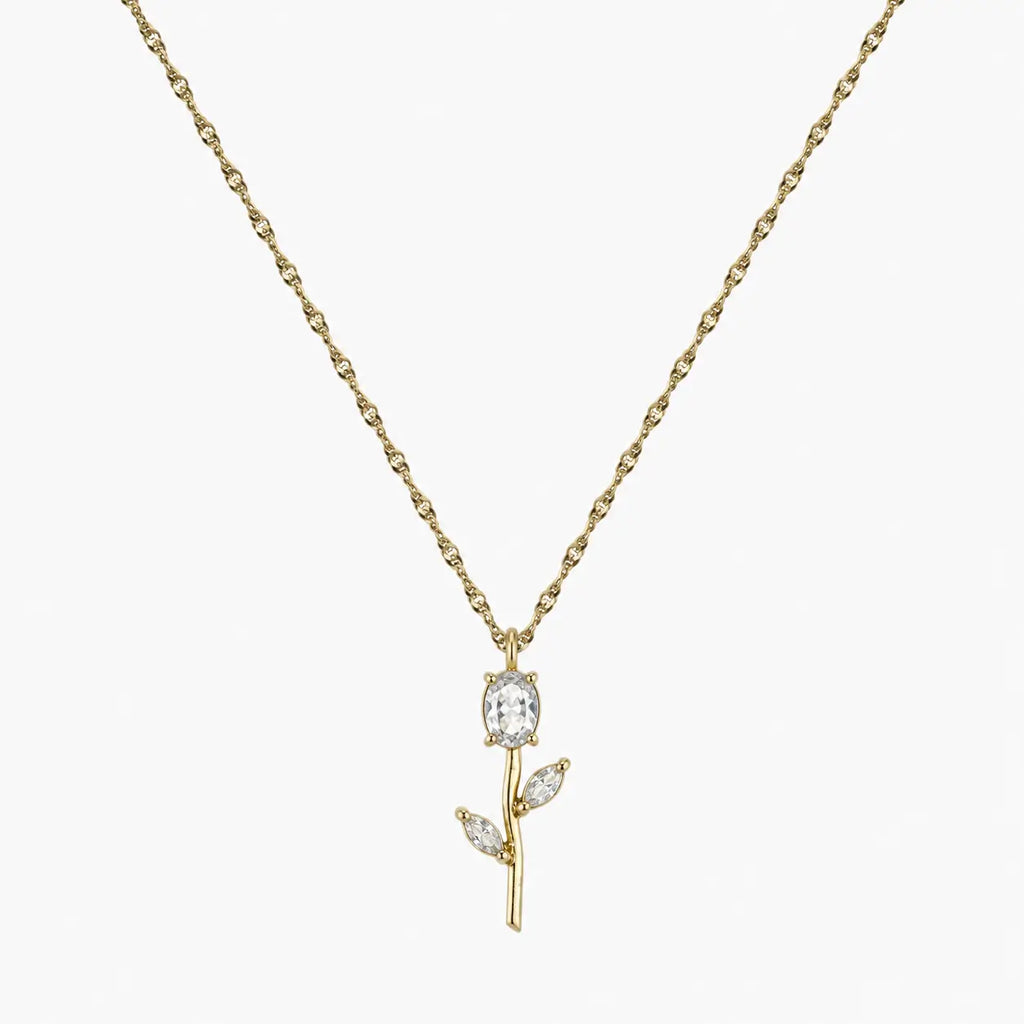 Close-up of clear crystal tulip pendant with marquise leaf details on gold-tone chain