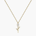 Close-up of clear crystal tulip pendant with marquise leaf details on gold-tone chain
