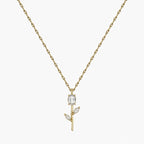 Close-up of clear crystal tulip pendant with marquise leaf details on gold-tone chain